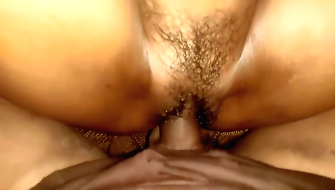 Indian brunette is fingering her pussy and pounding it