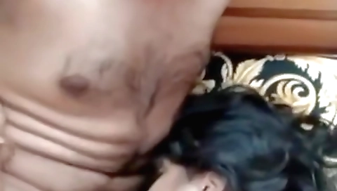 Indian amateur with blonde is giving a blowjob in the kitchen