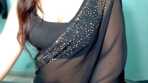 Indian brunette with a nice body is dancing and playing