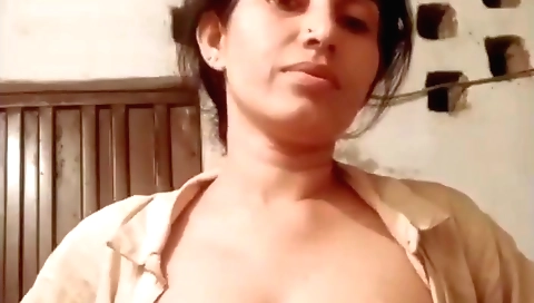 Busty brunette shows her natural boobs in solo video