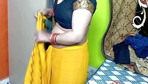 Indian beauty in yellow saree enjoys solo in hd video