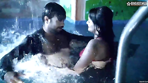 Indian brunette gets wet in the pool and plays with it
