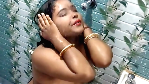 Chubby brunette with big boobs in a homemade shower video
