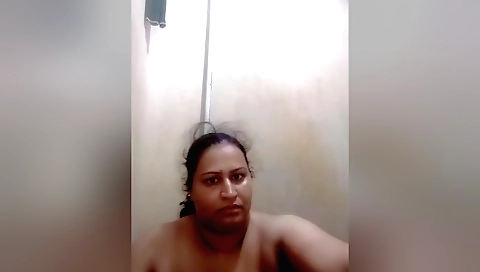 Busty indian milf shows off her body to the camera