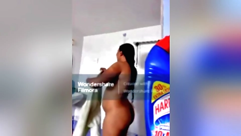 Indian babe in a black dress gets naked in homemade solo video