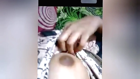 Indian girl with big boobs is playing with a dildo
