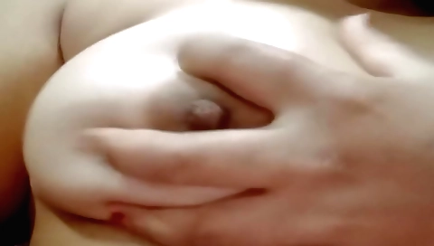 Indian solo girl masturbating on the bed in her clothes
