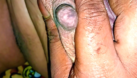 Indian girl on her knees giving a blowjob to a boy