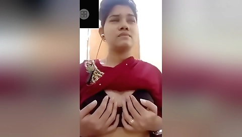 Big boobed brunette in sexy outfit is showing off her wet pussy